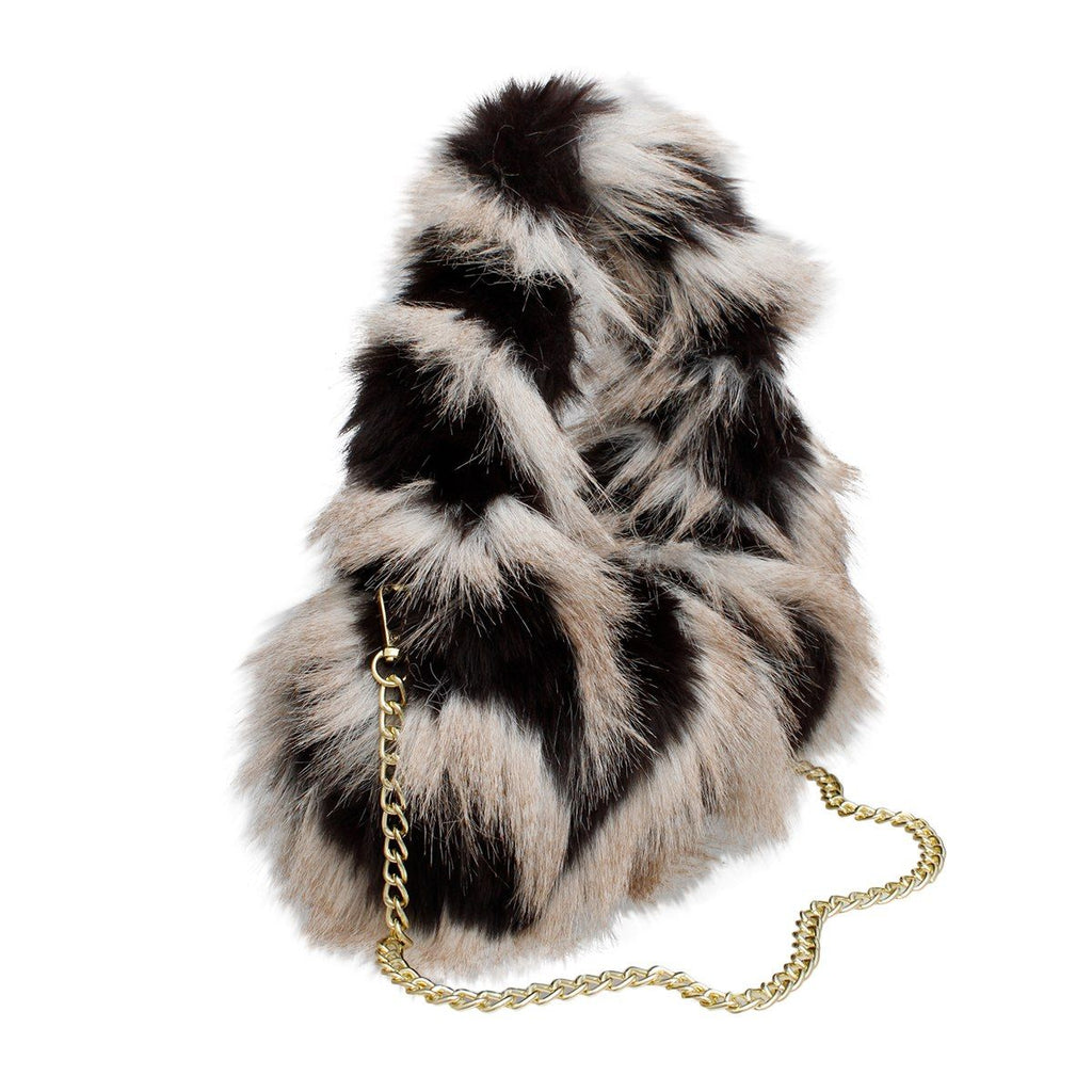 Cream-and-black striped shaggy faux-fur shoulder bag with a loop handle and gold-tone chain resting in front, on a white background