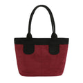 Burgundy faux-suede tote bag with black shoulder handles, black top trim and black handle tabs on a white background