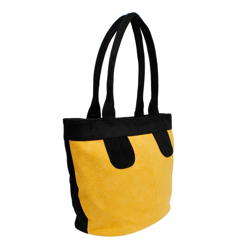 Angled view of a yellow-and-black faux-suede tote showing the yellow front, black side and long black handles