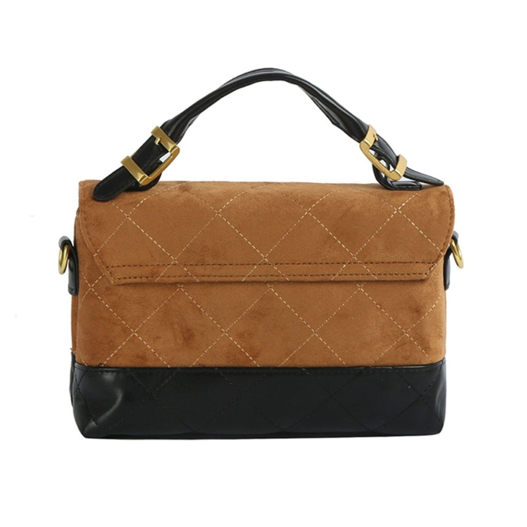Back view of the brown quilted flap bag with black quilted base, showing the black top handle, gold buckle hardware, and side strap ring