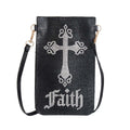 Front of a black phone crossbody bag covered in tiny black rhinestones, with a large silver crystal cross with ornate flared ends and script lettering below it, and a black strap with gold-tone swivel clips