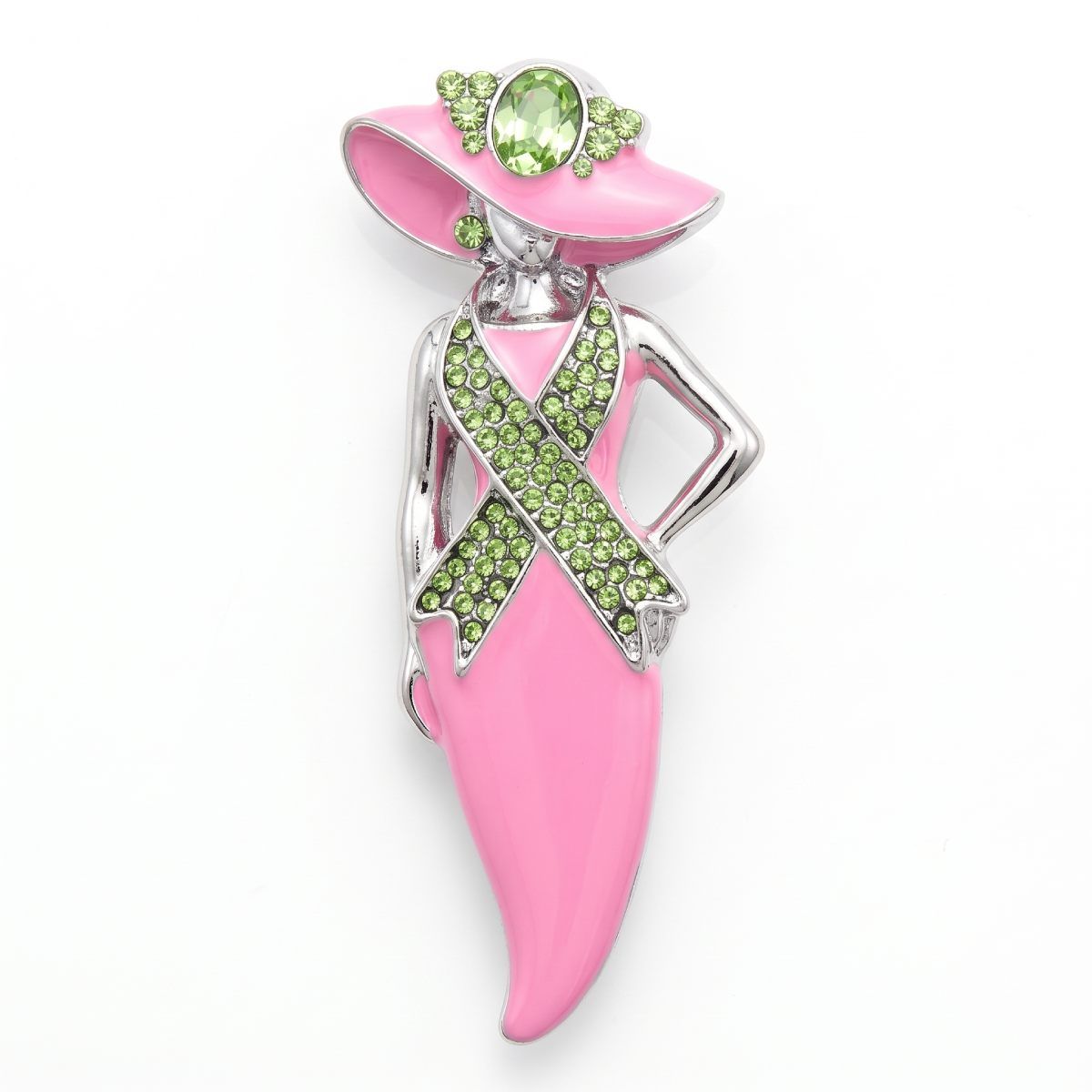 A pink and silver awareness ribbon brooch shaped like a woman wearing a pink hat, decorated with green rhinestones and a green gemstone, on a white background.