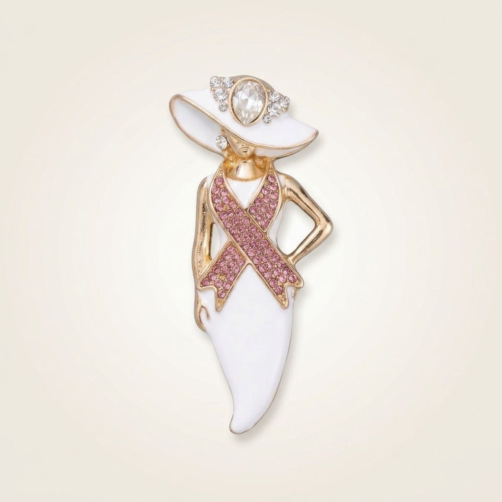 Pink ribbon white hat lady gold brooch pin with clear rhinestone hat trim and hand-on-hip pose, on cream background