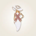 Pink ribbon white hat lady gold brooch pin with clear rhinestone hat trim and hand-on-hip pose, on cream background