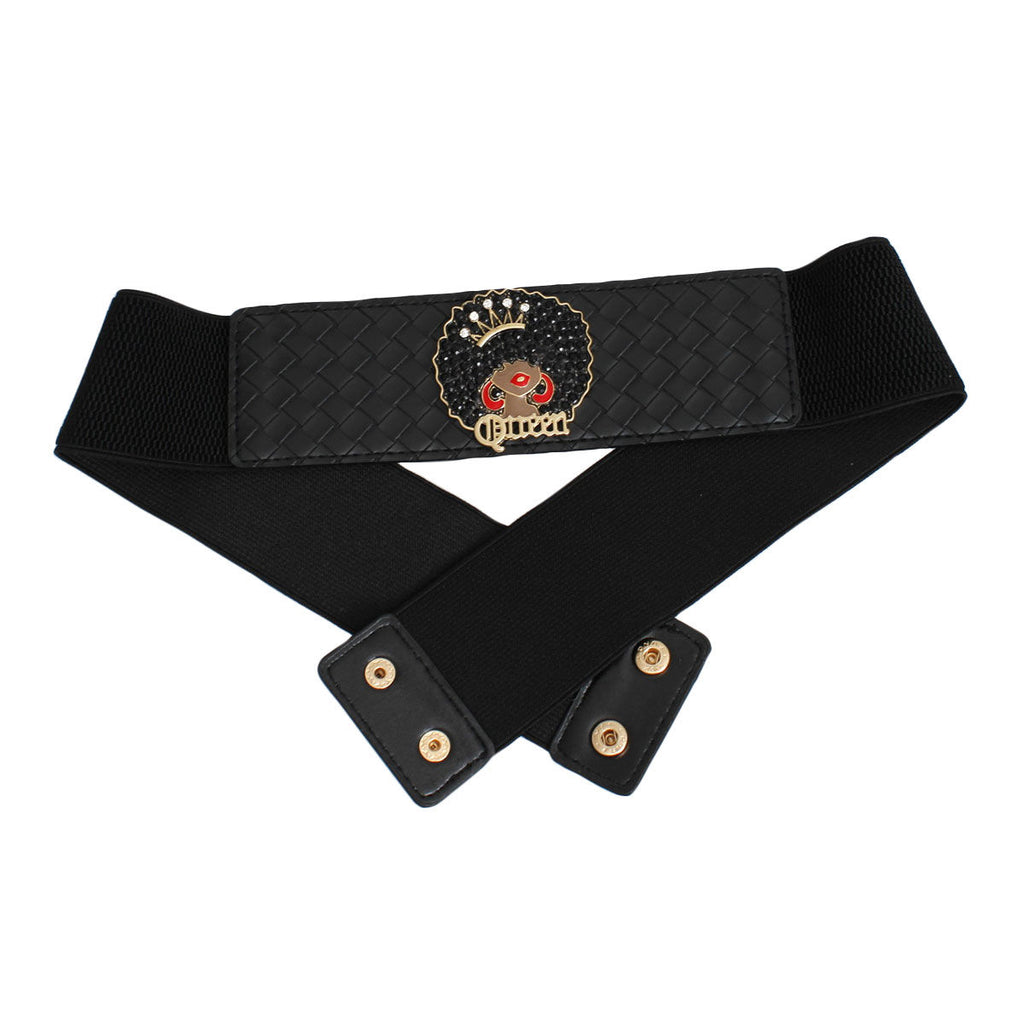 Black wide woven vegan leather stretch belt shown crossed on white background revealing snap closure mechanism, two gold snap buttons on black vegan leather tab ends, black canvas elastic stretch back panel, woven front panel with Afro Queen medallion visible at top