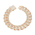 Overhead flat lay of a wide 14mm fully pave clear rhinestone Miami Cuban chain link bracelet arranged in a circle on a white background. A square push-lock box clasp fully covered in clear rhinestones is visible at the top with a safety latch closure in gold tone metal.
