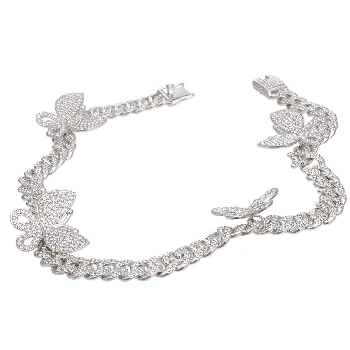Silver rhinestone-iced butterfly Cuban chain necklace flat lay showing pave butterfly stations and push-lock box clasp detail, white background