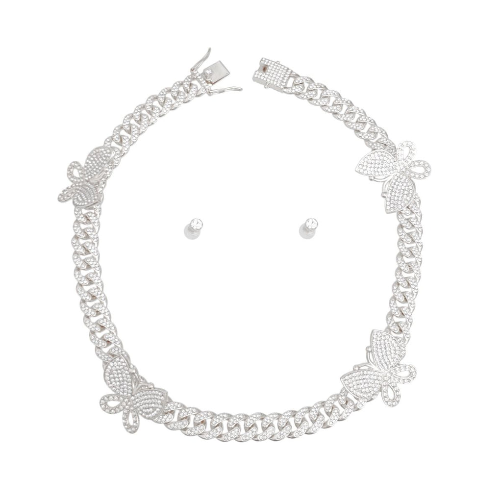 Silver rhinestone butterfly Cuban chain necklace set with matching small round stud earrings, flat lay on white background, push-lock clasp visible