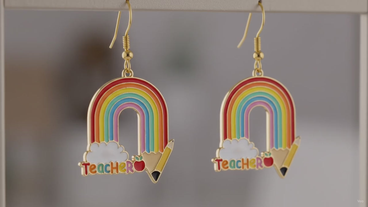 Video of rainbow Teacher pencil charm fish hook drop earrings showing multicolor enamel detail and movement
