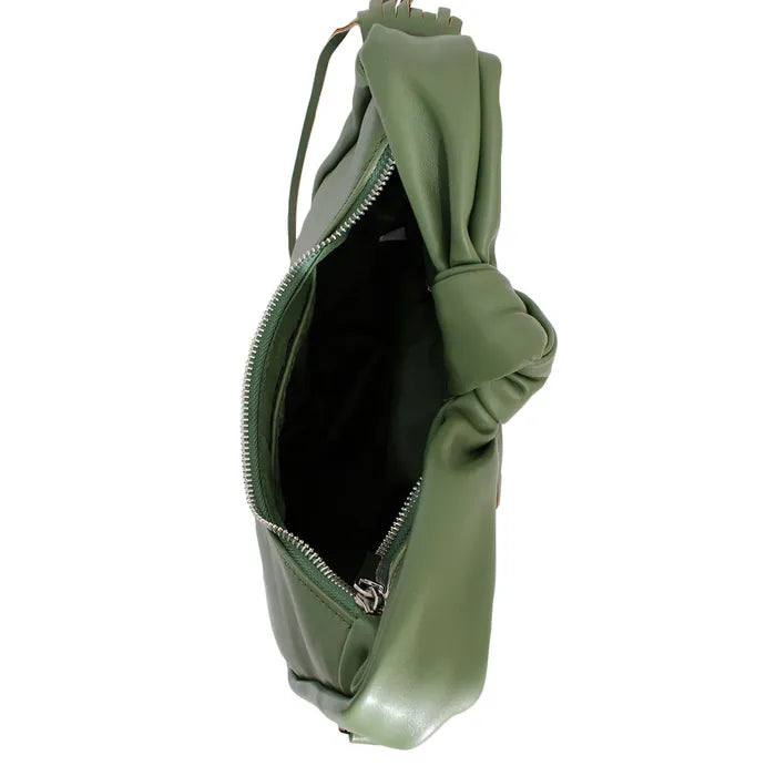 Top view of an open sage green handbag showing its dark interior, silver-tone zipper, and knotted handle against a white background