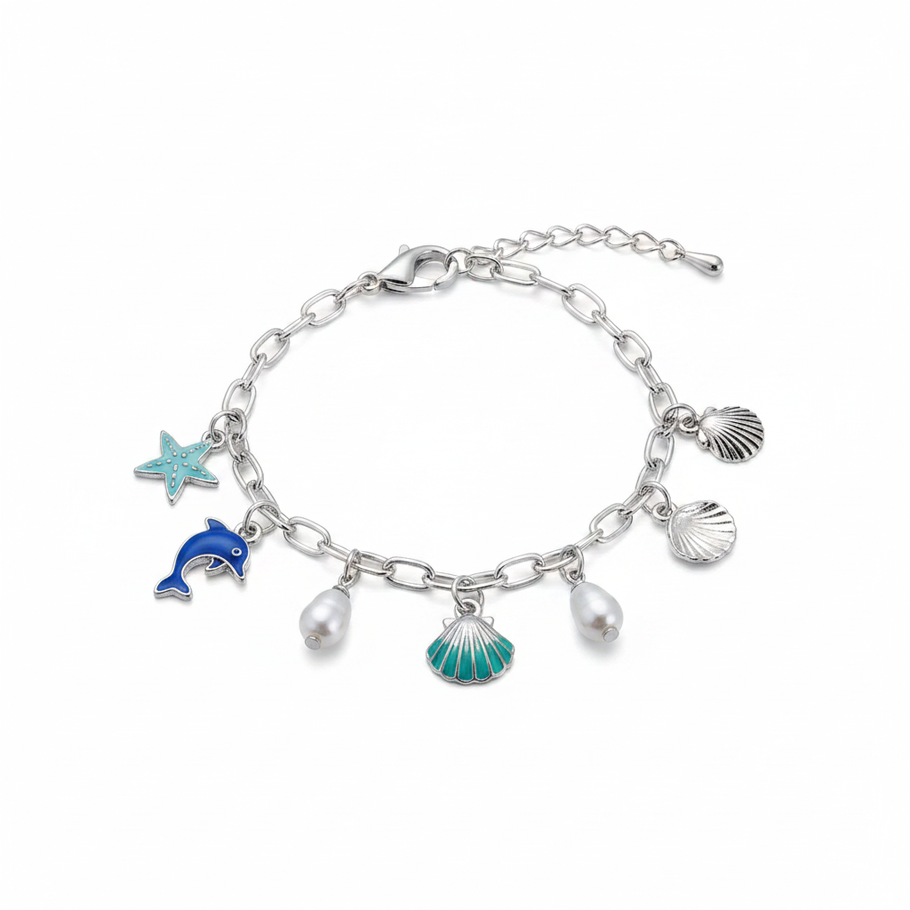 Ocean seashell charm station bracelet in silver-tone, Starfish & Dolphin style — silver paperclip link chain with lobster claw clasp and heart tag extender, 5 dangling charms: white oyster shell with pearl center, small white oyster shell with pearl, teal enamel flower, blue striped scallop shell, and silver scallop shell with pearl center, white background