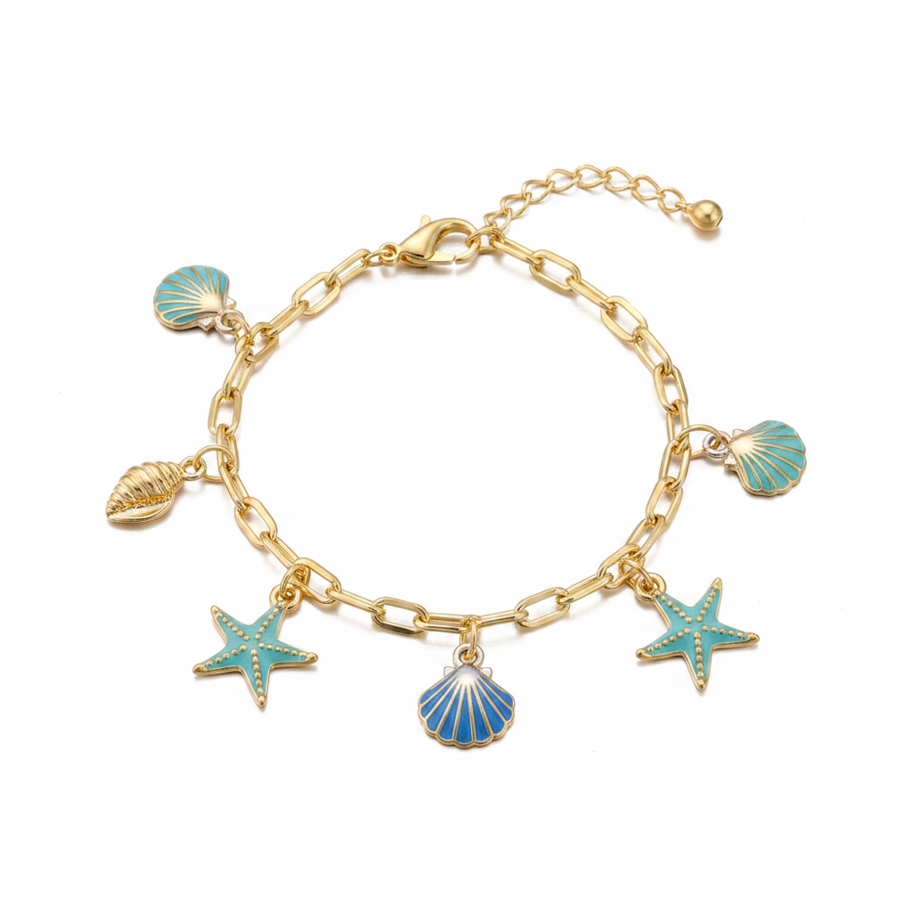 Ocean seashell charm station bracelet in gold-tone, Conch & Nautilus style — gold paperclip link chain with lobster claw clasp and ball extender, 5 dangling charms: teal scallop shell, gold conch shell, teal enamel starfish, blue striped scallop shell, and small teal scallop shell, white background