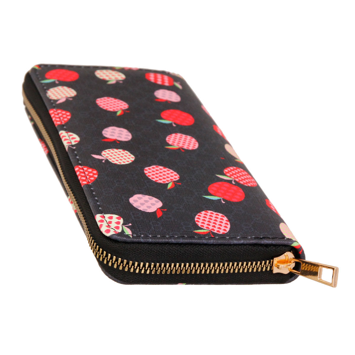 Black woven zipper wallet wristlet with scattered red and pink multicolor apple print on dark background, gold-tone zipper pull — top-down angled view showing zipper detail
