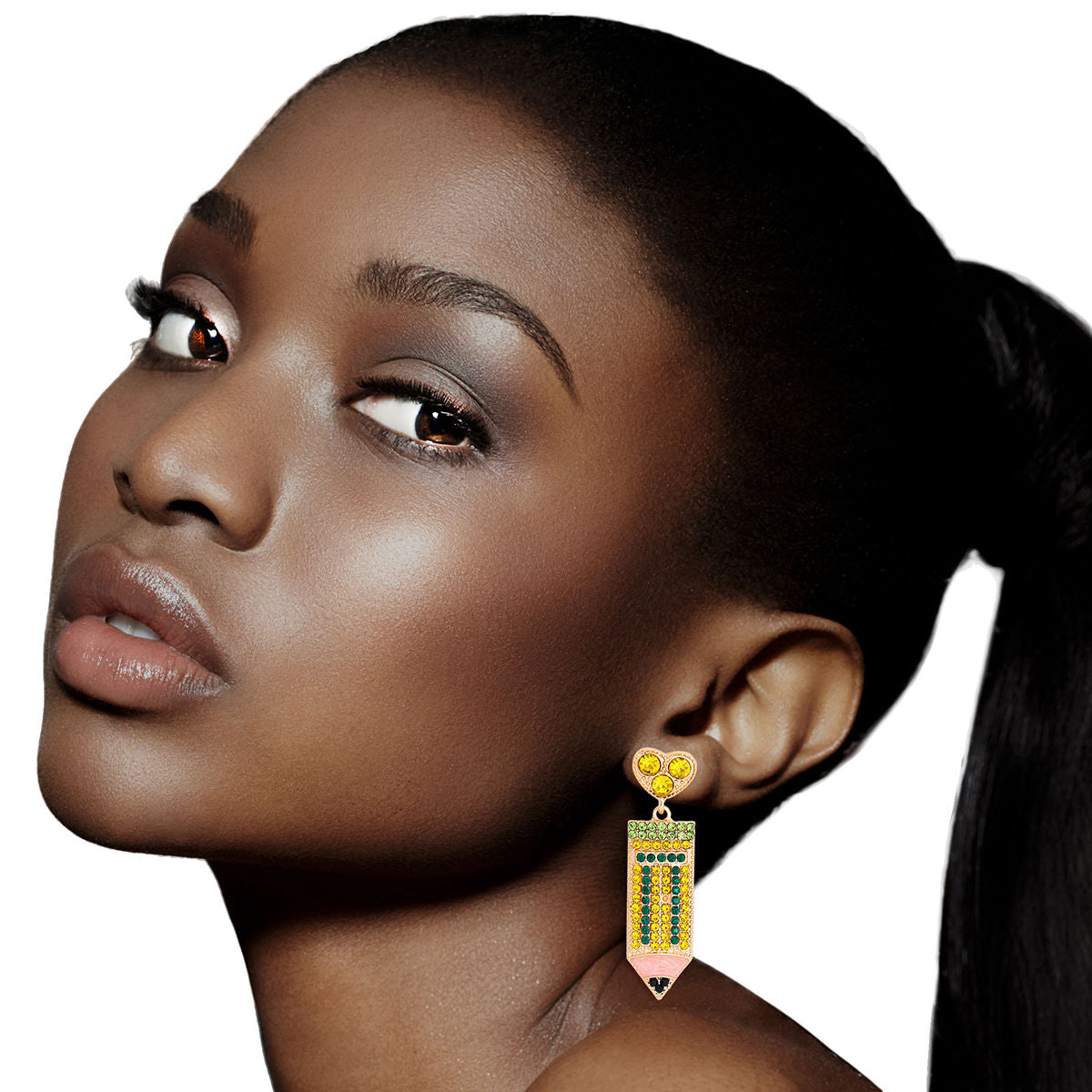 Woman wearing yellow and green rhinestone pencil drop earrings with gold-tone heart stud and pink enamel tip, close-up lifestyle model shot.